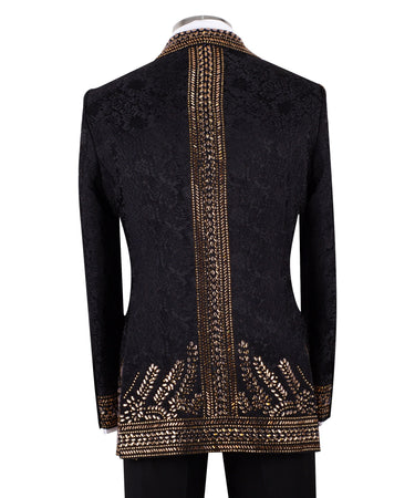 Front view of men's Gold Embellished Black Jacquard Double-Breasted Tuxedo by BTS Bespoke, showcasing intricate hand-applied gold details on a black jacquard fabric.