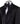 Front view of a black textured double-breasted tuxedo with hand-embellished shawl lapels, cuffs, and front trim. The trousers have a satin side stripe. High-end luxury formal wear from BTS Bespoke.