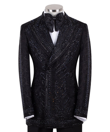 Front view of a luxurious black embellished jacquard double-breasted tuxedo jacket with intricate sequin and bead work on lapels, body, and sleeves, paired with black trousers, worn on a mannequin. From BTS Bespoke, handcrafted in Istanbul.