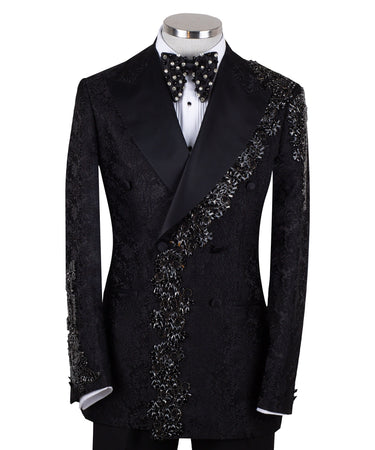 Black embellished jacquard double-breasted tuxedo with satin peak lapels and hand-beaded details on the shoulders and lapel, shown with matching plain black trousers with satin side stripe, handcrafted by BTS Bespoke in Istanbul.