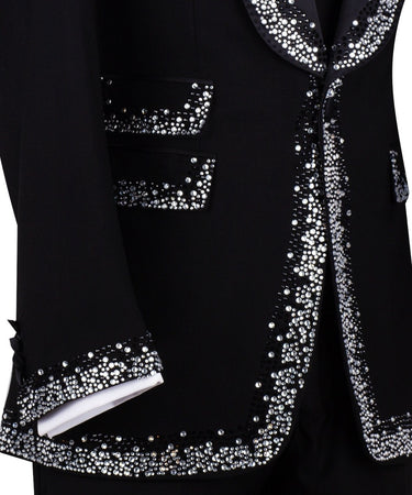 BTS Bespoke Black Embellished Shawl Lapel Tuxedo, featuring shimmering silver crystals hand-embellished on lapels, shoulders, pockets, and cuffs. The tuxedo includes a black single-breasted jacket, matching vest, and trousers, displayed on a mannequin. This luxury evening wear is handcrafted in Istanbul, showcasing master tailoring and intricate crystal detailing for a glamorous, statement look.