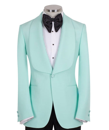 Aqua textured fabric shawl lapel tuxedo jacket on a mannequin, single-breasted, one-button closure. Showcase of BTS Bespoke's luxury handcrafted Istanbul tailoring.