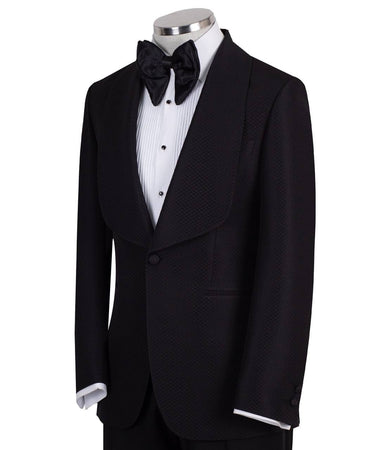 Black single-breasted tuxedo with subtle jacquard pattern and elegant shawl lapel, handcrafted in Istanbul by BTS Bespoke, front view on mannequin.