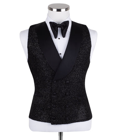 Front view of a black hand-embellished three-piece tuxedo by BTS Bespoke, featuring a single-breasted jacket with satin shawl lapels and a double-breasted vest, showcased on a mannequin.