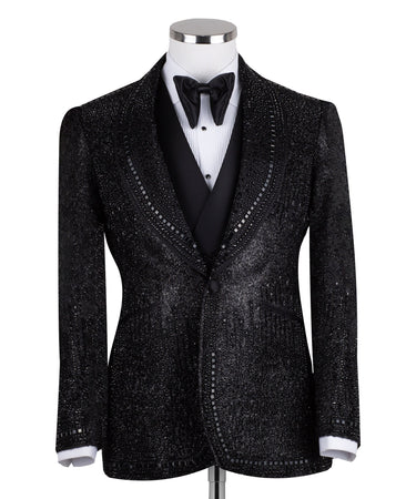 Front view of a black hand-embellished three-piece tuxedo by BTS Bespoke, featuring a single-breasted jacket with satin shawl lapels and a double-breasted vest, showcased on a mannequin.