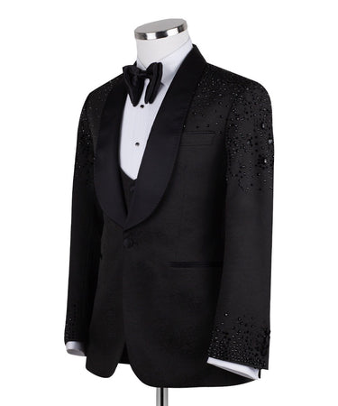 Black hand-embellished three-piece tuxedo by BTS Bespoke, featuring an intricate beaded pattern on the shoulders and back, satin shawl lapel, and matching vest and trousers. Masterfully crafted in Istanbul for luxury events.