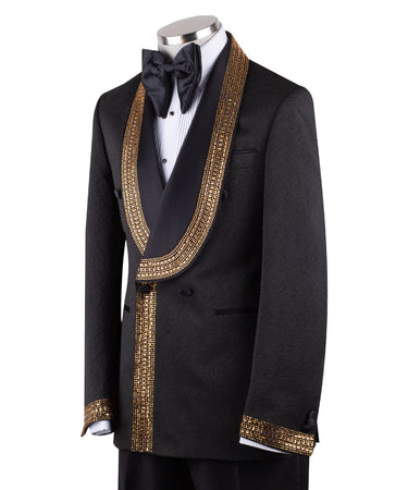 Mannequin wearing a black double-breasted tuxedo with ornate gold beaded peak lapels and matching cuff embellishments, paired with black satin-striped trousers.