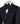 Front view of a luxurious black embellished jacquard double-breasted tuxedo jacket with intricate sequin and bead work on lapels, body, and sleeves, paired with black trousers, worn on a mannequin. From BTS Bespoke, handcrafted in Istanbul.