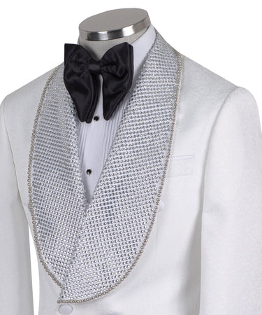 Full shot of a white double-breasted tuxedo with silver crystal-embellished shawl lapels and black trousers with satin stripes, displayed on a mannequin. Handcrafted luxury suit from BTS Bespoke.