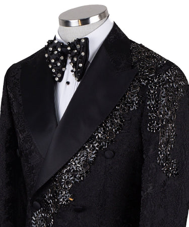 Black embellished jacquard double-breasted tuxedo with satin peak lapels and hand-beaded details on the shoulders and lapel, shown with matching plain black trousers with satin side stripe, handcrafted by BTS Bespoke in Istanbul.