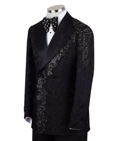 Black embellished jacquard double-breasted tuxedo with satin peak lapels and hand-beaded details on the shoulders and lapel, shown with matching plain black trousers with satin side stripe, handcrafted by BTS Bespoke in Istanbul.
