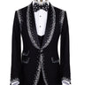 BTS Bespoke Black Embellished Shawl Lapel Tuxedo, featuring shimmering silver crystals hand-embellished on lapels, shoulders, pockets, and cuffs. The tuxedo includes a black single-breasted jacket, matching vest, and trousers, displayed on a mannequin. This luxury evening wear is handcrafted in Istanbul, showcasing master tailoring and intricate crystal detailing for a glamorous, statement look.