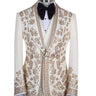 Cream and gold hand-embellished tuxedo jacket, vest, and black trousers from BTS Bespoke, handcrafted in Istanbul. Features intricate floral metallic stud detailing on a slim-fit, peak lapel design.