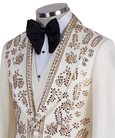 Cream and gold hand-embellished tuxedo jacket, vest, and black trousers from BTS Bespoke, handcrafted in Istanbul. Features intricate floral metallic stud detailing on a slim-fit, peak lapel design.