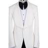 White textured shawl lapel tuxedo jacket and black trousers by BTS Bespoke, handcrafted in Istanbul. View shows single-button closure and elegant detailing.